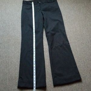 Black pants with thin white stripes